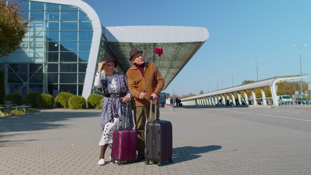 Airport arrival hall with travelers looking for transportation.